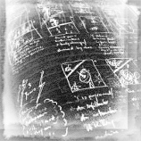 black and white photo of notepad with small pictures